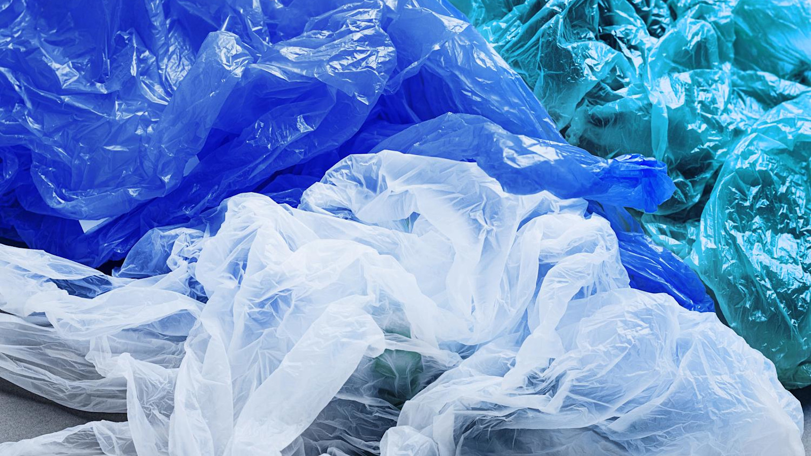 Compressed polythene plastic film waste for recycling